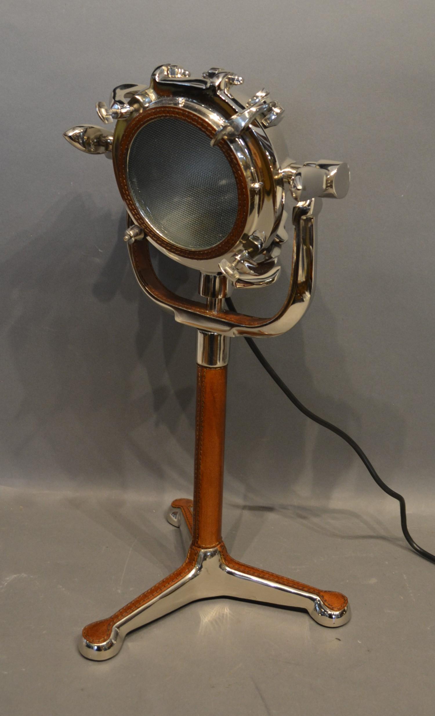 A Chromium and Leather Desk Lamp in the form of a port hole 49cm tall