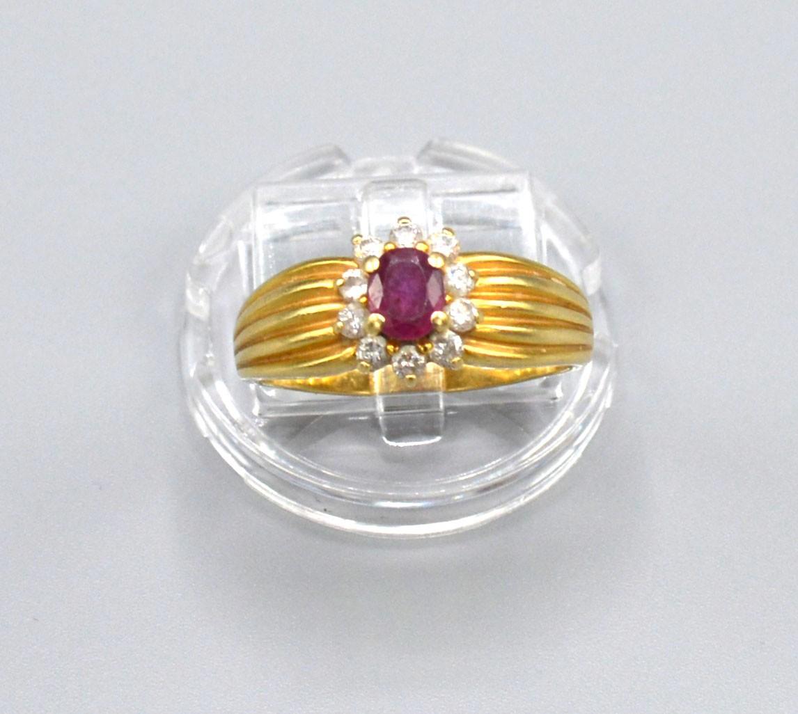 A tested 18ct Yellow Gold Ruby and Diamond Ring set with central ruby surrounded by diamonds - Image 2 of 2