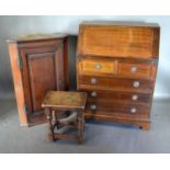 A Mahogany Bureau, the fall front enclosing a fitted interior above two short and three long drawers