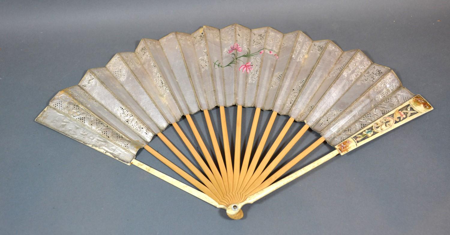 A 17th Century Silver Leafed Decoupe Fan with hand painted decoration depicting figures within a - Image 2 of 2