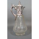 A Victorian and Silver Cut Glass Claret Jug with shaped handle and with foliate etching. London