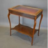 A Edwardian Mahogany and Line Inlaid Bijouterie Cabinet with a glazed hinged top above a plain