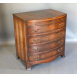 An Early 20th Century Mahogany Bow-Fronted Chest, the cross-banded top above a brushing slide and