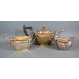 A George VI Sheffield Silver Tea Set comprising of teapot, cream jug and sucrier of shaped