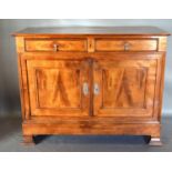 A French Fruitwood Dresser Base with two frieze drawers above two panel doors with brass drop