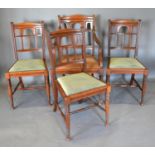 A Set of Four Late Victorian Walnut Dining Chairs by James Shoolbred comprising of one armchair