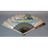 An Early Silver Leafed and Pierced Decoupe Fan hand painted with figures and rural scene on the