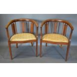 A Pair of Edwardian Mahogany and Line Inlaid Tub-shaped Chairs with panel and spindle back above