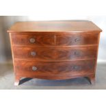 A Mahogany Bow Fronted Chest of two short and two long drawers with circular brass handles, with