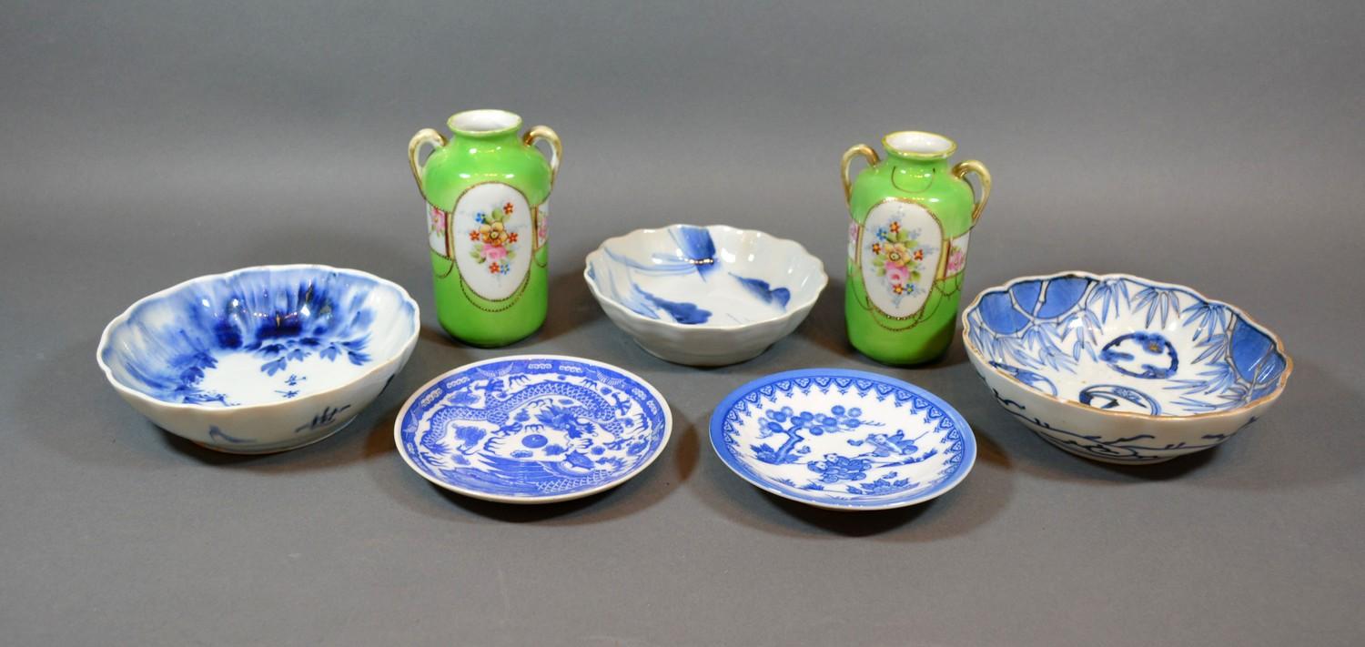 A Group of Three Japanese Underglaze Blue Decorated Bowls, together with two similar smaller and a