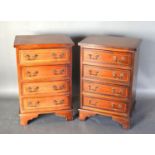 A Pair of 20th Century Mahogany lined inlaid bedside chests of four drawers, brass handles upon