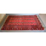 A Bokhara Woollen Rug with two rows of gulls upon a wine red ground within multiple boarders 207cm x