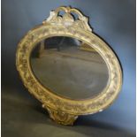 A 19th Century French Gilded Oval Wall Mirror with pierced cresting 80cm high by 74cm wide