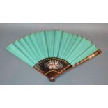 A Green Paper-leafed Fan with painted and gilded sticks and guards, 25cm long