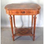 A French Kingwood Work Table, the hinged top enclosing a fitted interior raised upon turned tapering