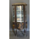 A French Vernis Martin Style Vitrine with a bow glass door and painted panel enclosing glass and