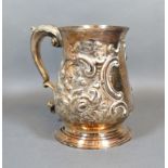 A George II Silver Mug bearing inscription with later embossing and shaped handle London 1757 Makers