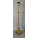 A Brass Adjustable Lamp Standard with a shaped basket top above an adjustable Corinthian column upon