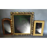 A Gilt Framed Rectangular Wall Mirror of shaped outline together with two other smaller wall mirrors