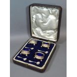 A Set of Four Birmingham Silver Salts with spoons within fitted lined case