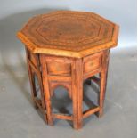 A Moorish Octagonal Occasional Table the top with brass inlay above a similar stand 43.5cm diameter,