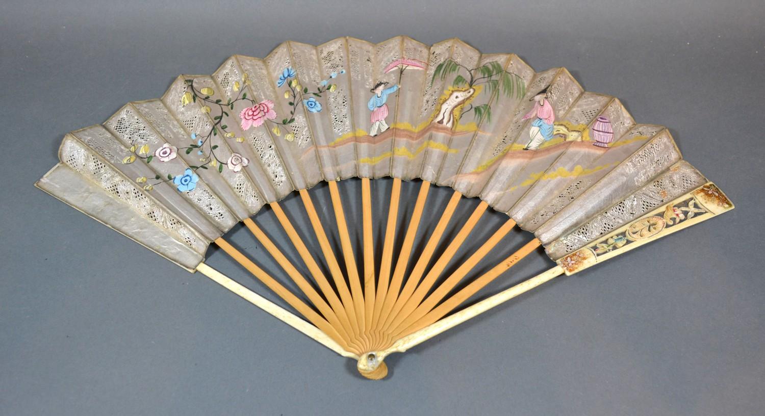 A 17th Century Silver Leafed Decoupe Fan with hand painted decoration depicting figures within a