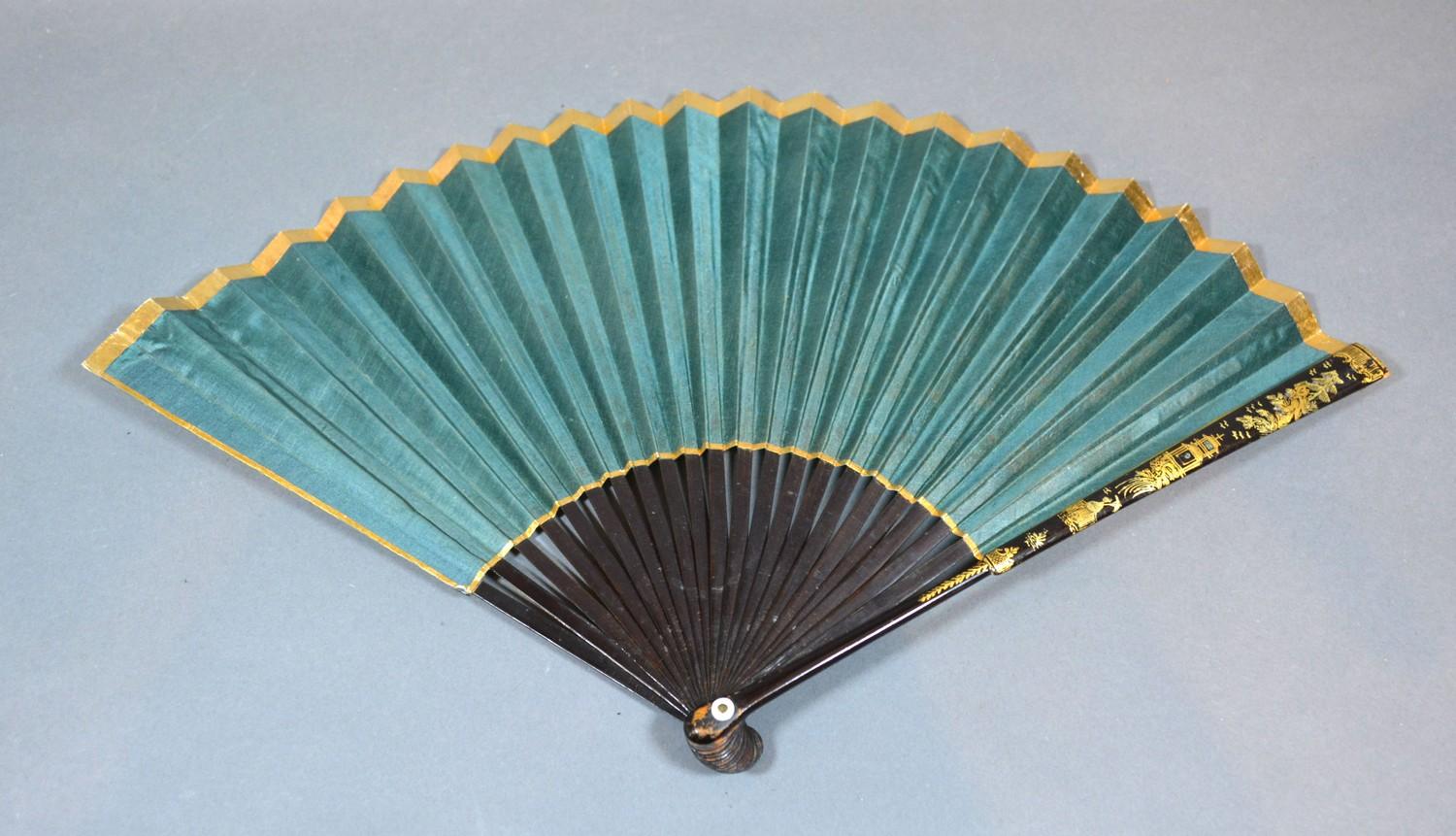 A Regency Period Fan with plain green silk leaf within a gilt border, lacquered sticks and guards, - Image 2 of 2