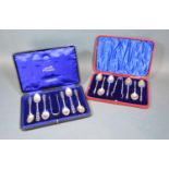 A Set of Six Birmingham Silver Teaspoons with matching tongs with Celtic woven handles within fitted