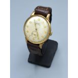 A 9ct Gold Cased Gentleman's Wrist Watch by Trebex with leather strap