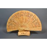 A Bone Temple Fan with separate base carved with the figure of a heron, the fan leaf carved with