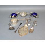 A Georgian Silver Tea Caddy Spoon together with a three piece silver condiment set and other small