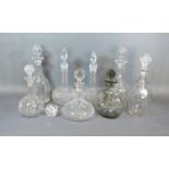 A Collection Eight Glass Decanters with stoppers