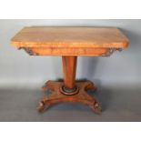 A William IV Mahogany Card Table the hinged top above a scroll carved frieze above an octagonal