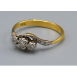 A 18ct Yellow Gold Diamond ring set with three diamonds within a crossover setting, Size R, 3.3