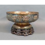 An Indian White Metal Rose Bowl with embossed decoration depicting figures upon a shaped foot and