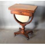 A William IV Mahogany Games Work Table, the hinged top above a frieze drawer and U stretcher with