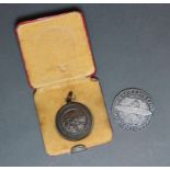 A Five Reichsmark Graf Zeppelin Weltflug 1929 Coin together with a Royal Life Saving Society Medal