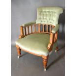 A Late Victorian Walnut and Marquetry inlaid Drawing Room Armchair, the buttoned upholstered back