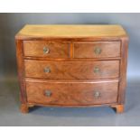 A 19th Century Mahogany Bow Fronted Chest with two short and two long drawers circular brass handles