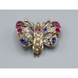 A Yellow Metal Brooch in the Form of a Butterfly set with diamonds, rubies, sapphires and pearls,
