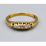 A 18ct Yellow Gold Diamond Ring set with five diamonds within a pierced setting, Size P, 2.8 grams