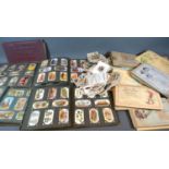 A Collection of Cigarette Cards to include Wills, Players and many others within albums and loose