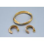 An 18ct. Gold Bracelet of Tri Form together with a pair of matching earrings, 26.6 gms