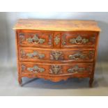 An 18th Century Oak Serpentine Commode, the moulded top above two short and two long drawers with
