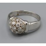A 14ct White Gold Diamond Cluster Ring set with many diamonds with a dome setting, Size N, 3 grams