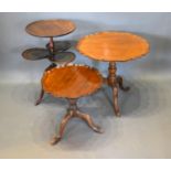 A Mahogany Occasional Table, the dish top above three smaller with outswept legs together with two