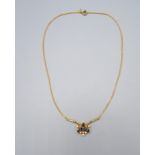 An 18ct Gold Necklace the pendant set with five oval sapphire and six diamonds with fine link chain,