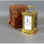 A French Brass Cased Miniature Carriage Clock, the enamel dial with Roman numerals and inscribed