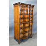 An Early 20th Century Walnut Serpentine Chest on Chest, the moulded cornice above seven graduated