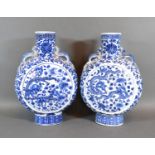 A Pair of 19th Century Chinese Moon Flasks each decorated in underglaze blue with serpents amongst